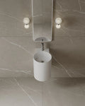 15-Inch wall-mounted matte white basin in small Mississauga powder room renovation