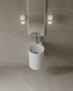 15-Inch wall-mounted matte white basin in small Mississauga powder room renovation