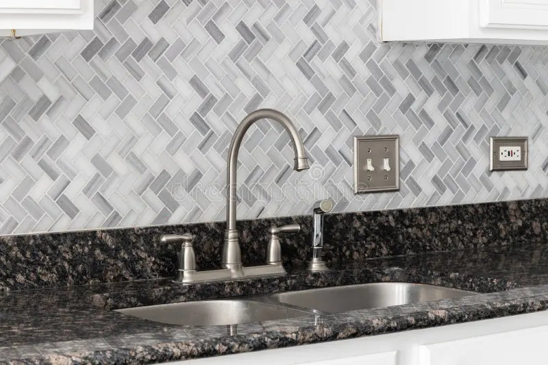 12x12 Arctic Mist Herringbone Marble Mosaic Tile sheet with soft white-grey polished finish – TF Renovations Mississauga