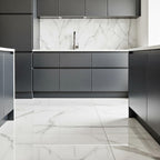 Carrara polished porcelain tile installed as luxury kitchen floor in GTA renovation